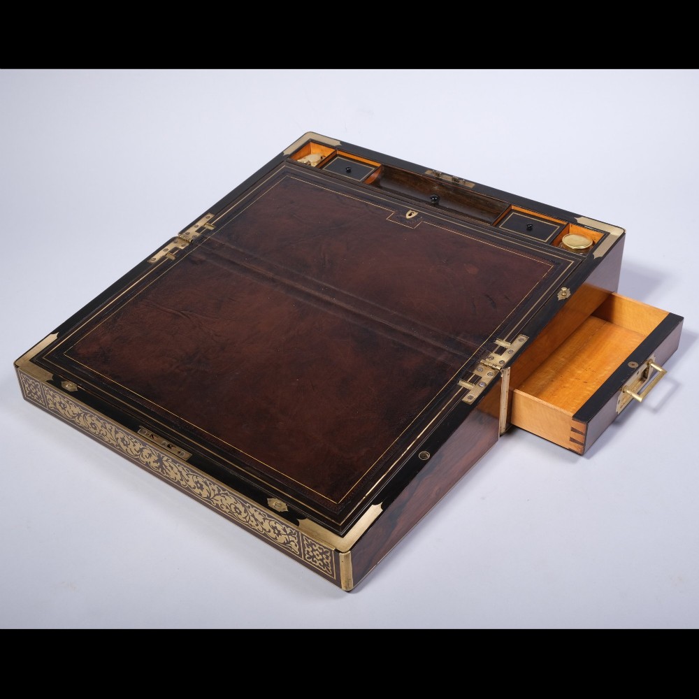 A rectangular dark wood writing box featuring intricate floral brass scrollwork inlay across the top lid and front panel. View II