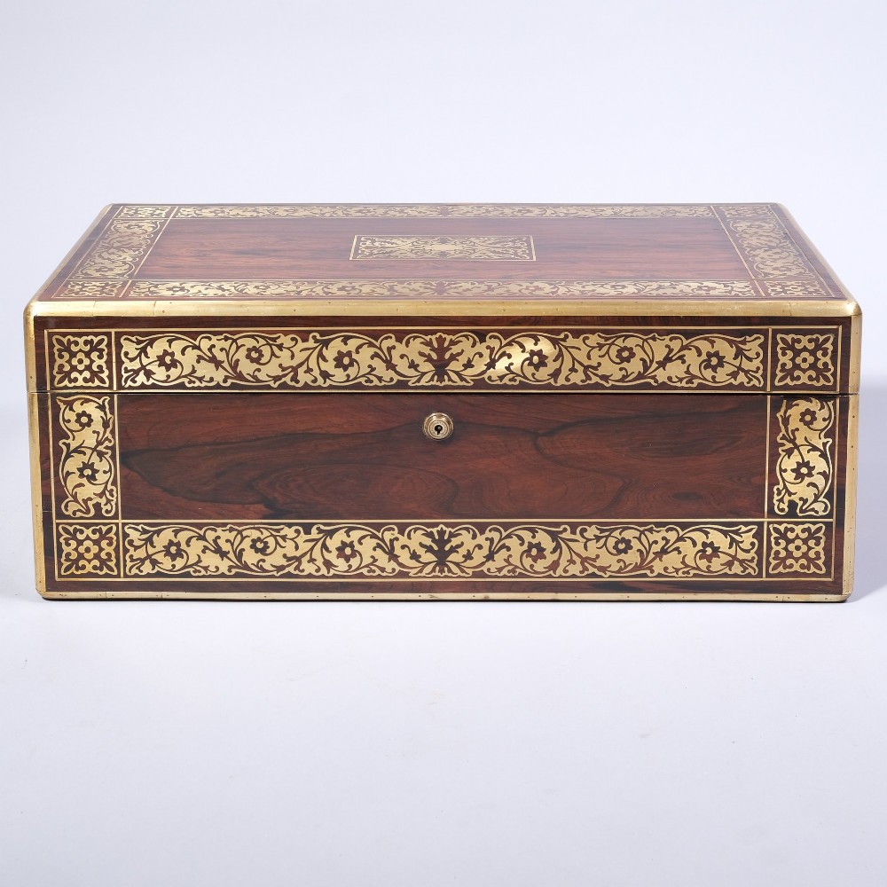 A rectangular dark wood writing box featuring intricate floral brass scrollwork inlay across the top lid and front panel. View VII