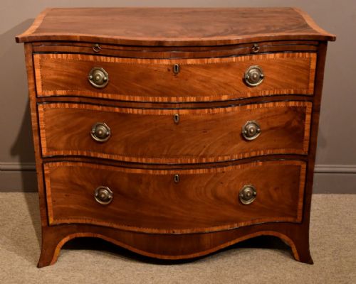 A Fine Late 18th Century Mahogany and Satinwood Serpentine Chest of Drawers