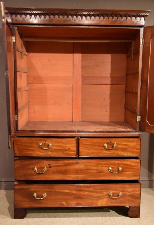 fig 1. A Handsome George III Mahogany Oval Panelled Linen Press