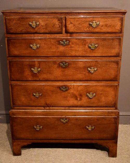 An Attractive George II Oak Chest on Stool with Walnut Cross-banding