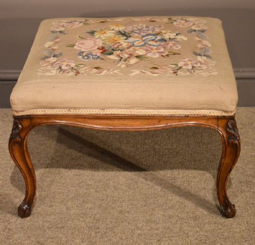 An Attractive Victorian Carved Walnut Footstool