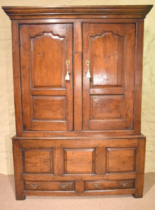 A Late George II Oak Livery Cupboard