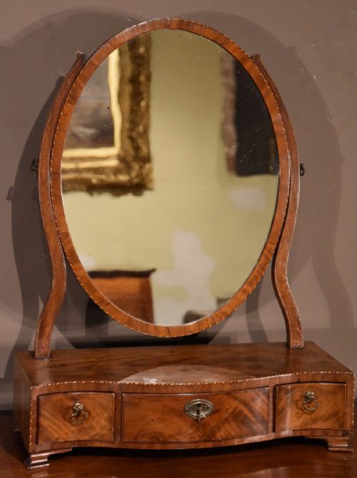 An Elegant George III Mahogany Oval Box Mirror