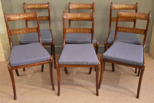 A Fine Set of Rosewood and Brass Inlaid Dining Chairs