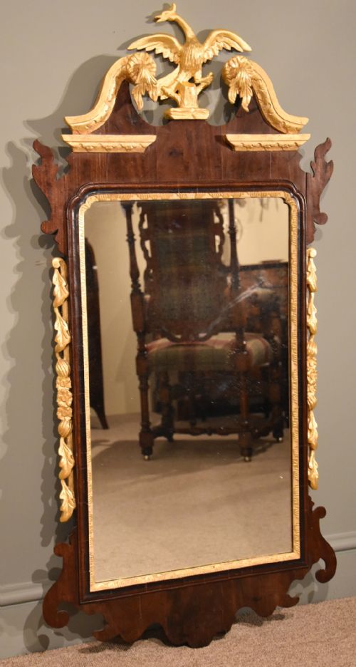 A Mid 19th Century Parcel Gilt and Mahogany Wall Mirror
