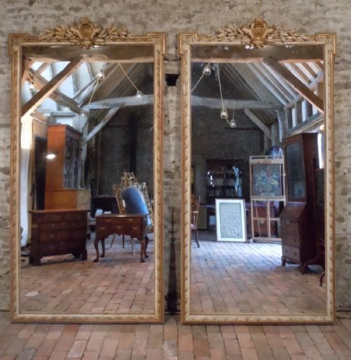 A Rare Pair of Large Mid 19th Century French Parcel Gilt and Ivory Painted Pier Mirrors