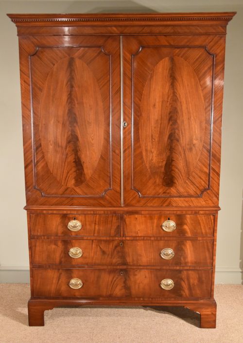 George III Mahogany Linen Press with Oval Flamed Panels