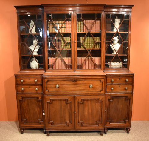 A Very Fine George III Mahogany Break Front Bookcase with Satinwood Interior