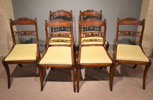 A Good Set of Six Well Carved Regency Sabre Leg Chairs
