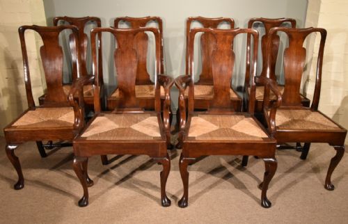 An Attractive Set of Eight George II Oak Dining Chairs