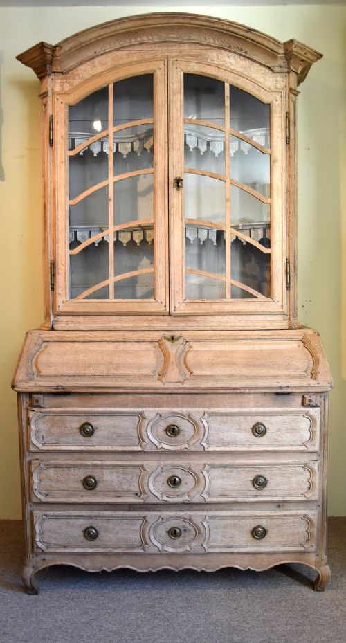 A Mid 18th Century French Stripped Oak Bureau Bookcase