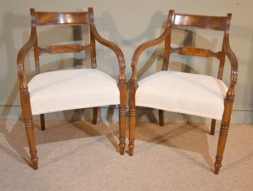 A Pair of Regency Mahogany Elbow Dining Chairs