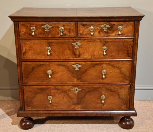 A Superb George I Walnut and Featherbanded Chest of Drawers