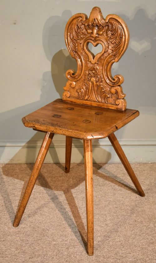 A Highly Unusual Swiss Carved Solid Walnut Hall Chair