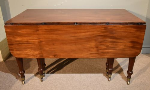 A Good Regency Period Mahogany Concertina Action Dining Table