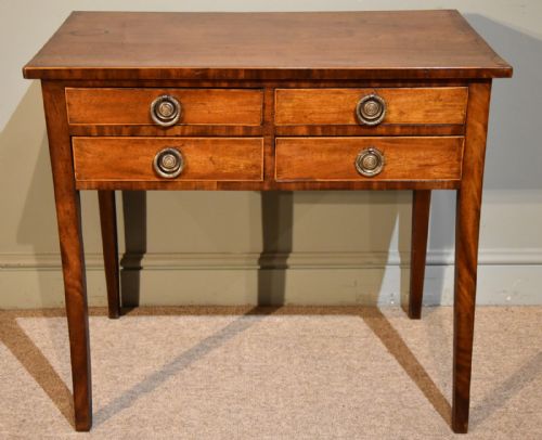 A George III Mahogany and Crossbanded Four Drawer Lowboy