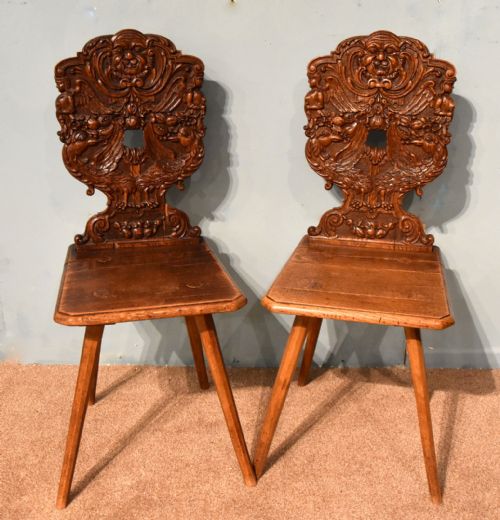 A Good Pair of Black Forest Swiss Hall Chairs