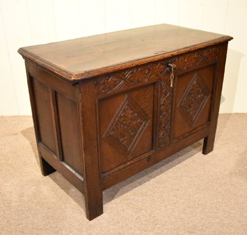 A SMALL EARLY 18TH CENTURY OAK TWO PANELLED COFFER - ADDITIONAL PHOTO 1