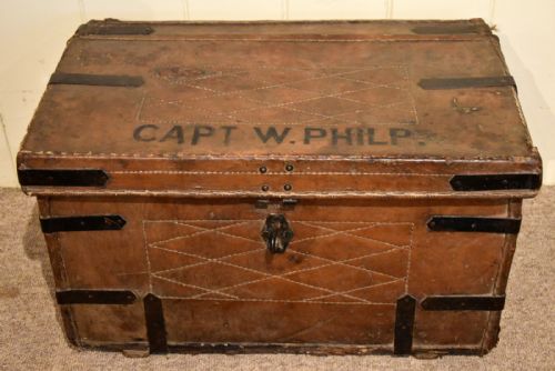 A MID 19TH CENTURY LEATHER AND IRON BOUND TRUNK - ADDITIONAL PHOTO 1