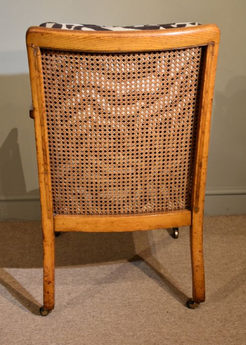 REGENCY PERIOD OAK BERGERE ARMCHAIR - ADDITIONAL PHOTO 5