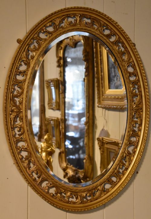 carved open fretwork giltwood oval mirror - CATEGORY: ANTIQUE MIRRORS - DATED 19TH CENTURY