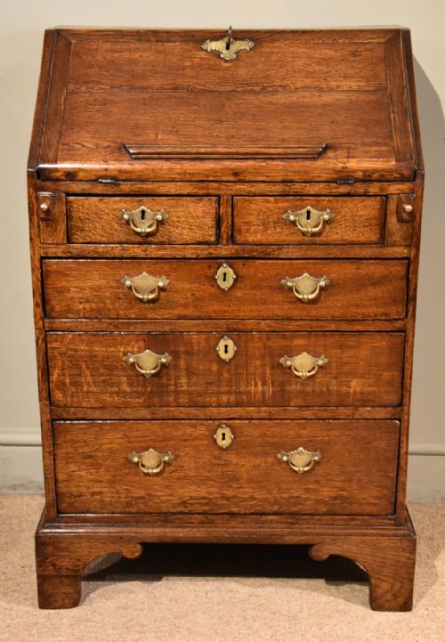 a diminutive george iii oak bureau - CATEGORY: ANTIQUE BUREAU - DATED GEORGIAN