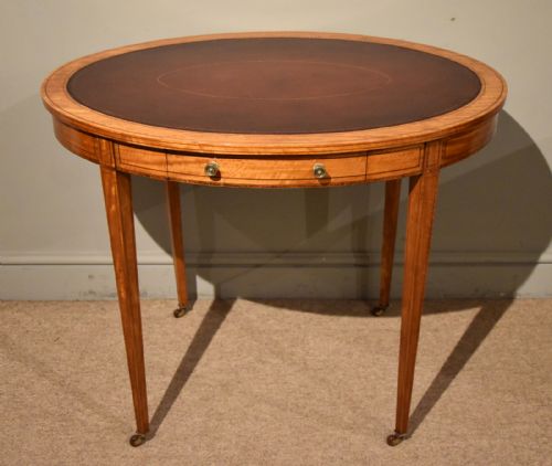 19th century oval satinwood writing table - CATEGORY: ANTIQUE TABLES - DATED 19TH CENTURY