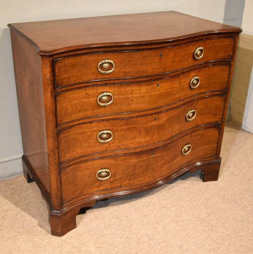 GEORGE III SERPENTINE MAHOGANY CHEST OF DRAWERS - ADDITIONAL PHOTO 1