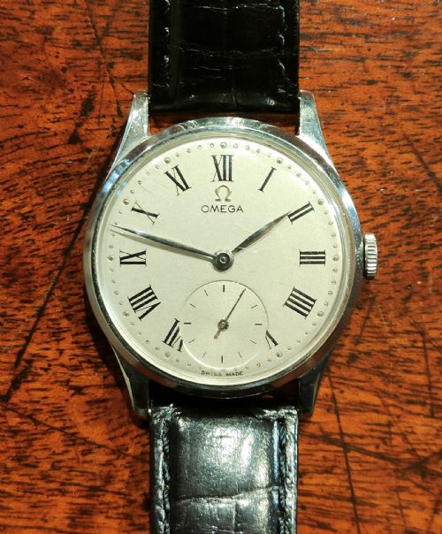 mid 20th century steel omega wristwatch black leather strap - CATEGORY: ANTIQUE WATCHES - DATED 1940