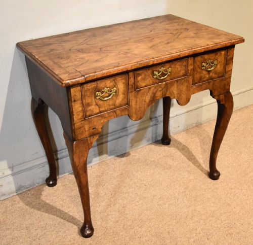 George I Walnut and Feather Banded Lowboy