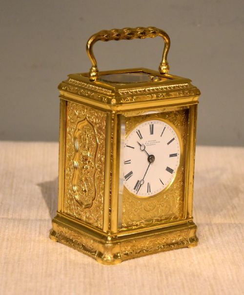 AN ENGRAVED GORGE CASED CARRIAGE CLOCK - ADDITIONAL PHOTO 1
