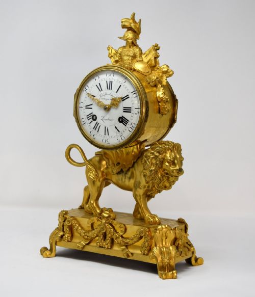 A FRENCH ORMOLU MANTLE CLOCK OF LION FORM - ADDITIONAL PHOTO 2