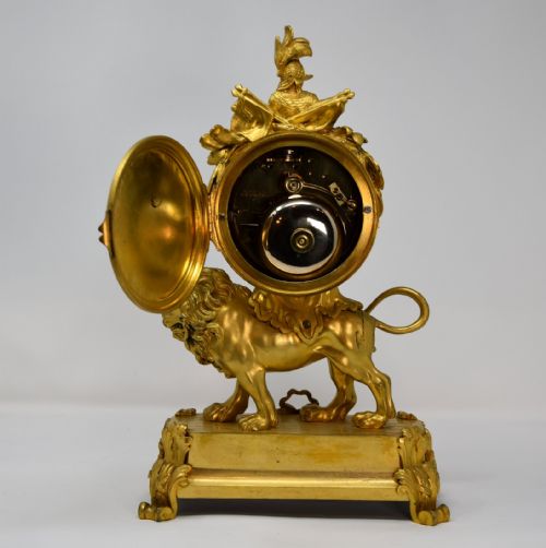 A FRENCH ORMOLU MANTLE CLOCK OF LION FORM - ADDITIONAL PHOTO 3