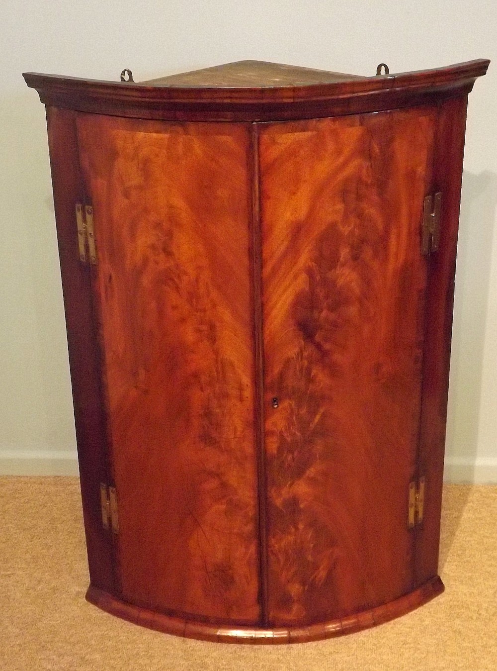 Mahogany Flamed Bow Fronted Corner Cabinet c1780