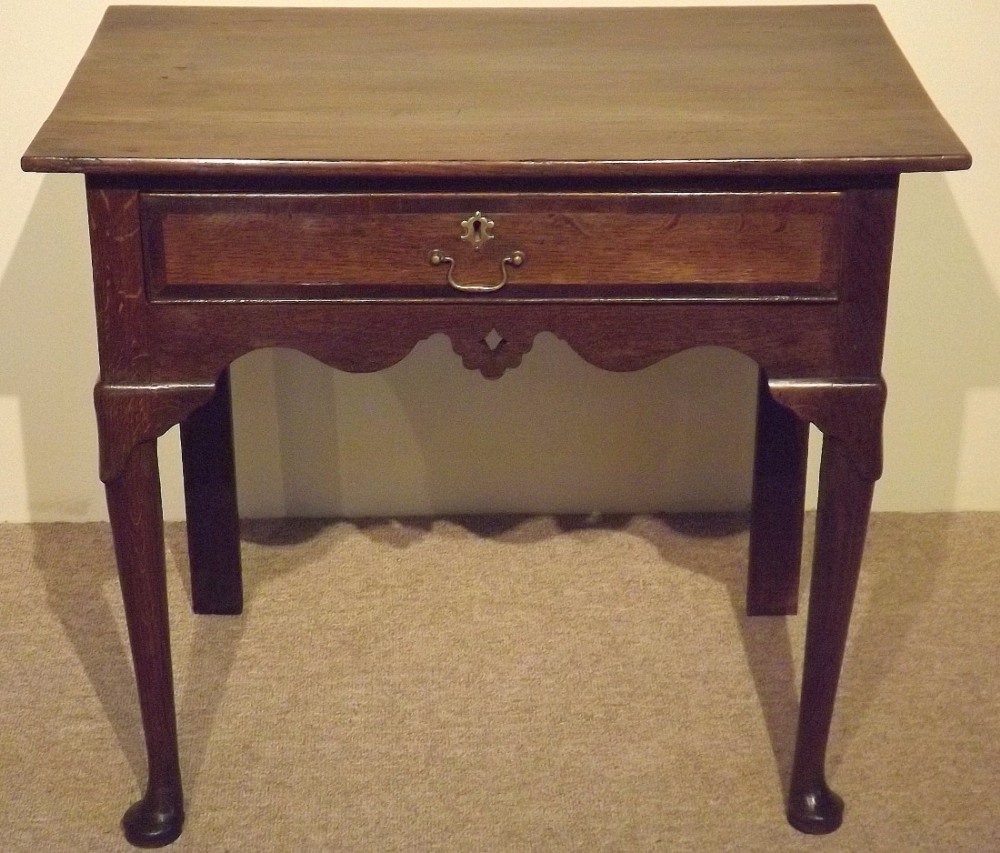A Mid 18th century Oak Lowboy on Pad Feet c1750