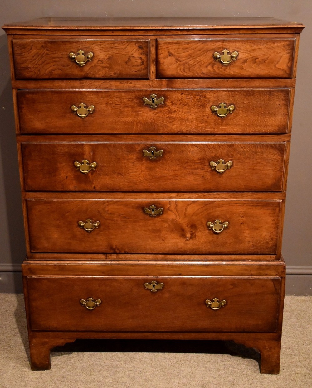 An Attractive George II Oak Chest on Stool with Walnut Cross-Banding