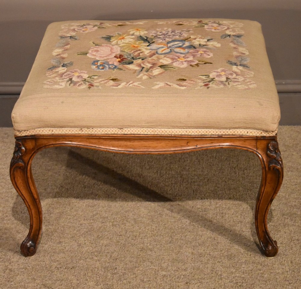 An Attractive Victorian Carved Walnut Footstool