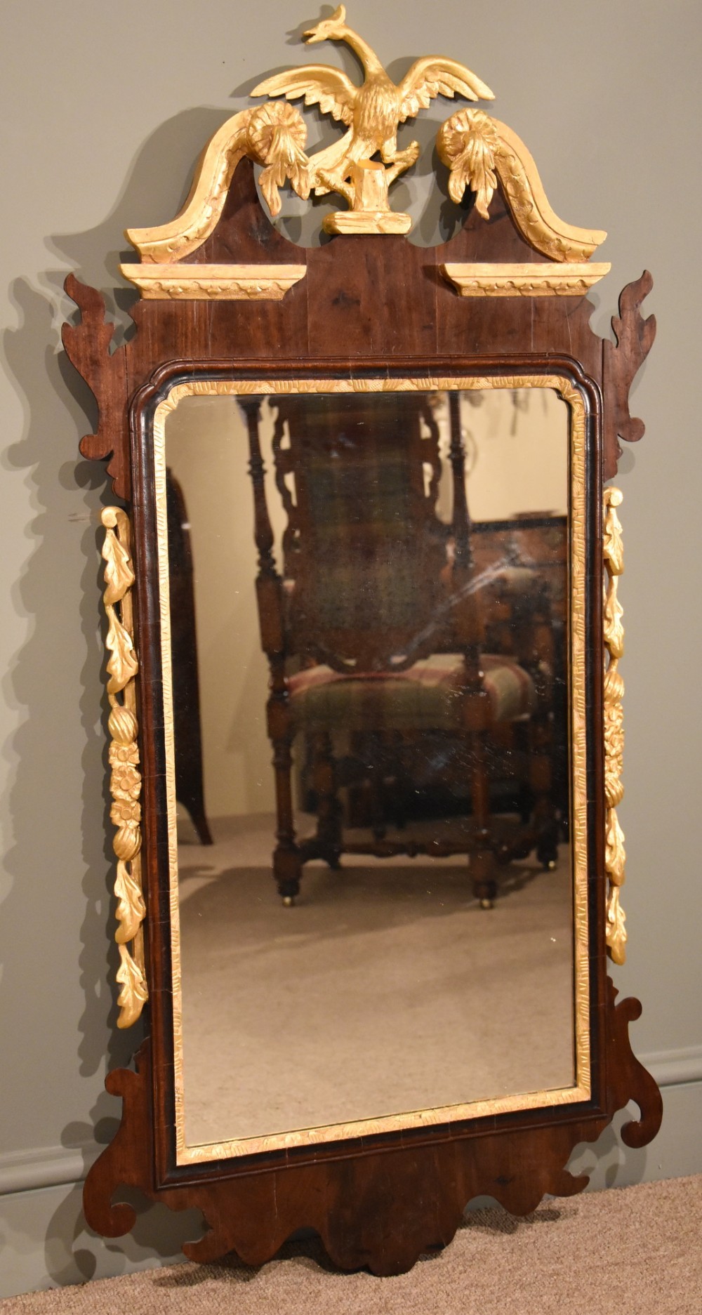 A Mid 19th Century Parcel Gilt and Mahogany Wall Mirror