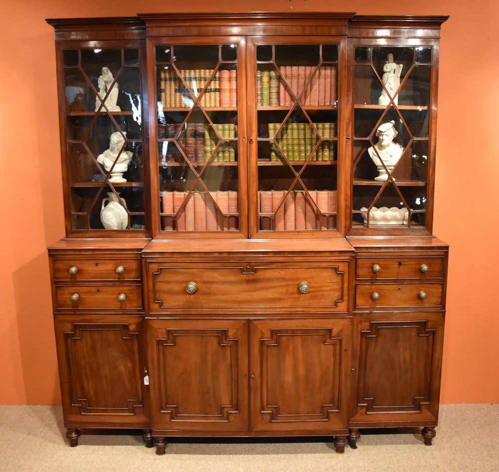 A Very Fine George III Mahogany Break Front Bookcase with Satinwood Interior