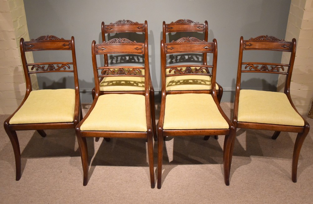 A Good Set of Six Well Carved Regency Sabre Leg Chairs