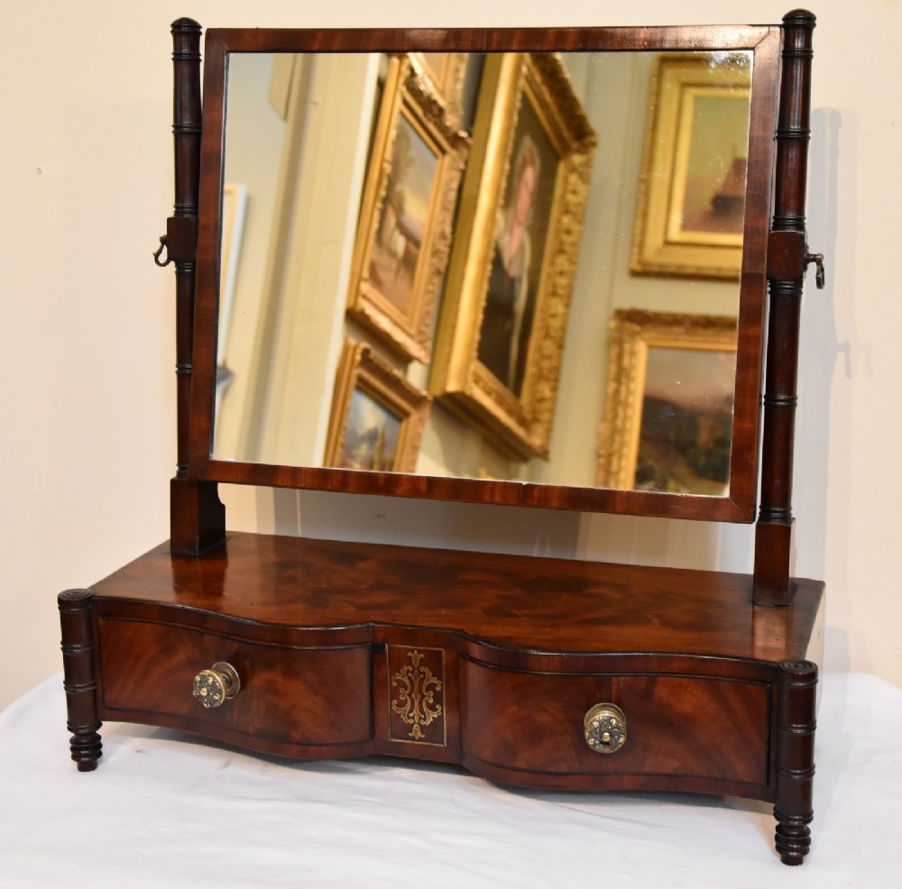 A Regency Serpentine Fronted Dressing Mirror
