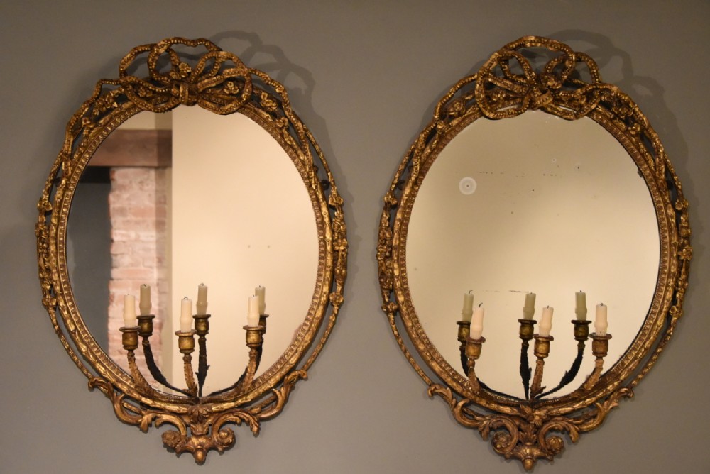 A Pair of 19th Century Oval Gilt Gesso Girandole Mirrors