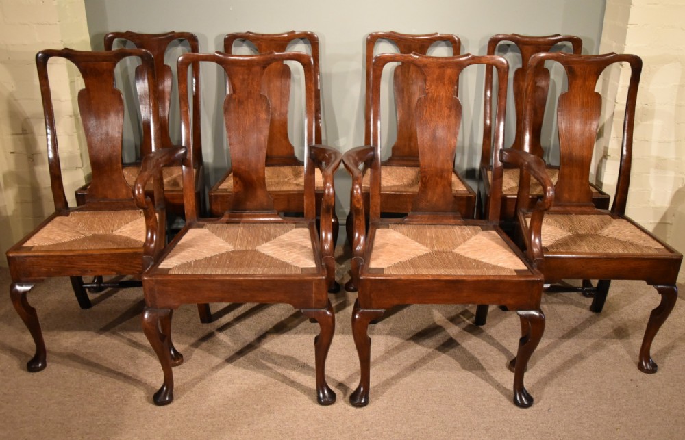 An Attractive Set of Eight George II Oak Dining Chairs