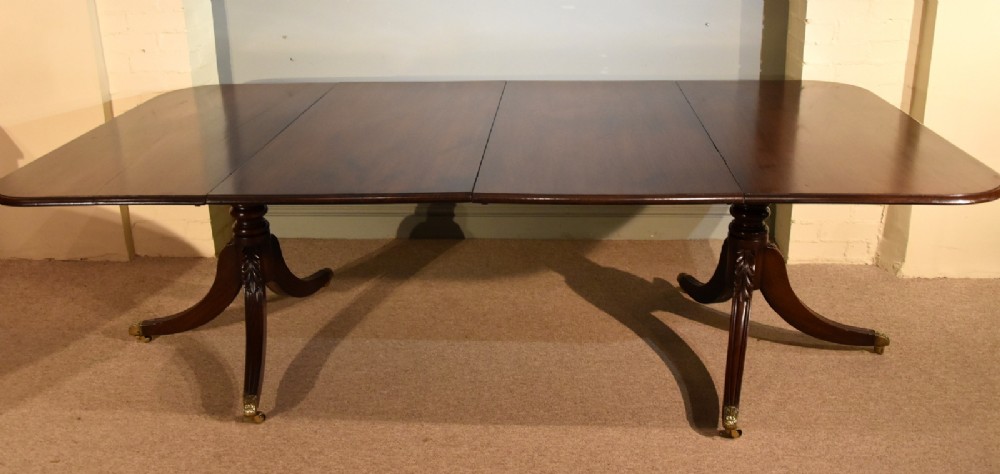 A Superb Regency Two Pillar Dining Table