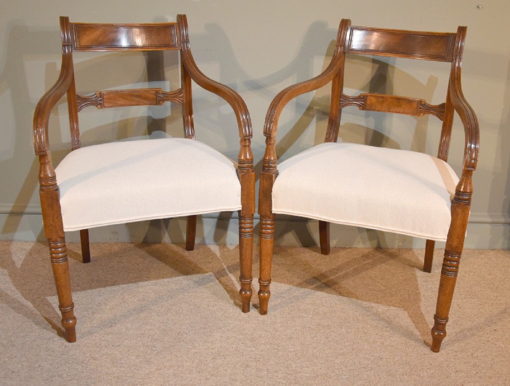 A Pair of Regency Mahogany Elbow Dining Chairs