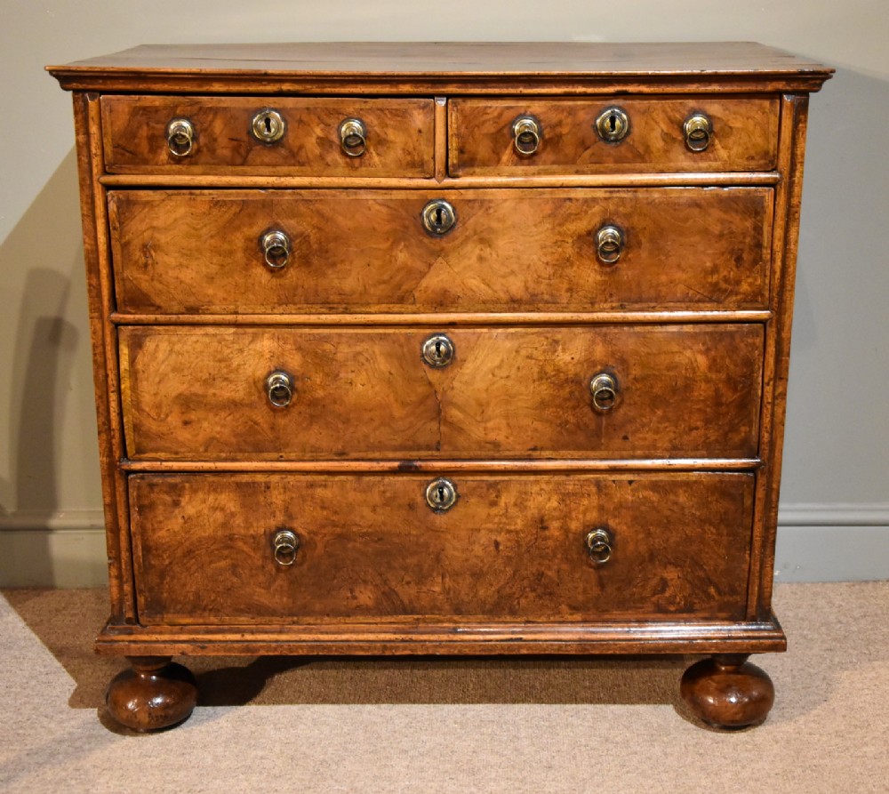 A Delightful Queen Anne Period Walnut Chest of Drawers