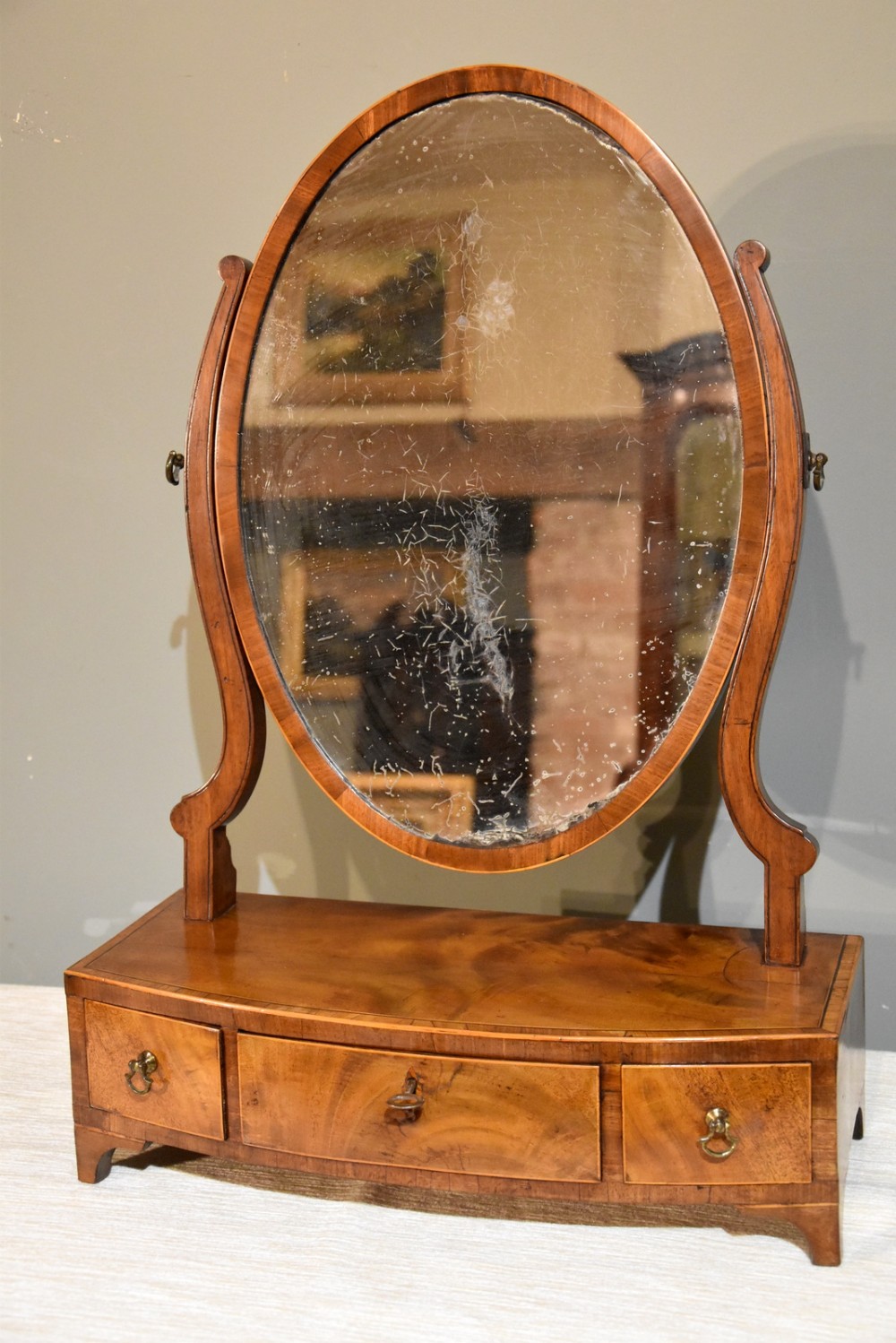 An Elegant George III Bow Fronted Box Mirror