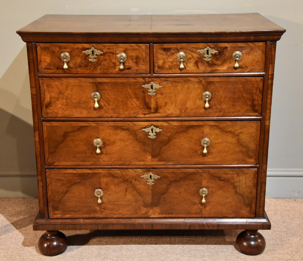 A Superb George I Walnut and Featherbanded Chest of Drawers 