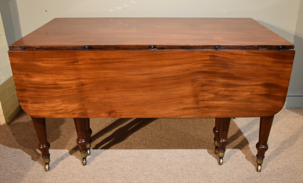 A Good Regency Period Mahogany Concertina Action Dining Table